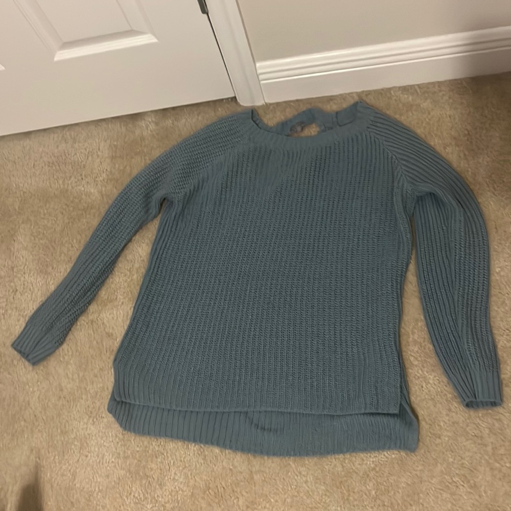 Blue sweater with slightly open back
